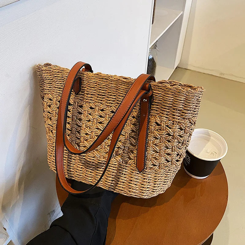 Woven cross-stitch tote bag beige on table with coffee cup