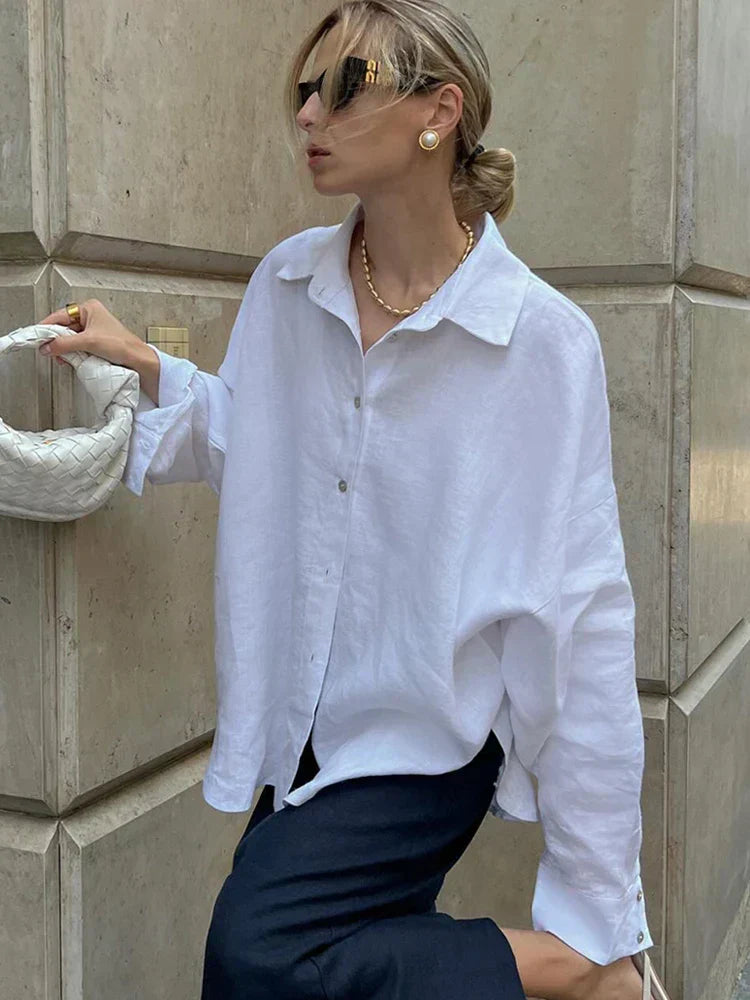 White linen blouse with black pants, street style