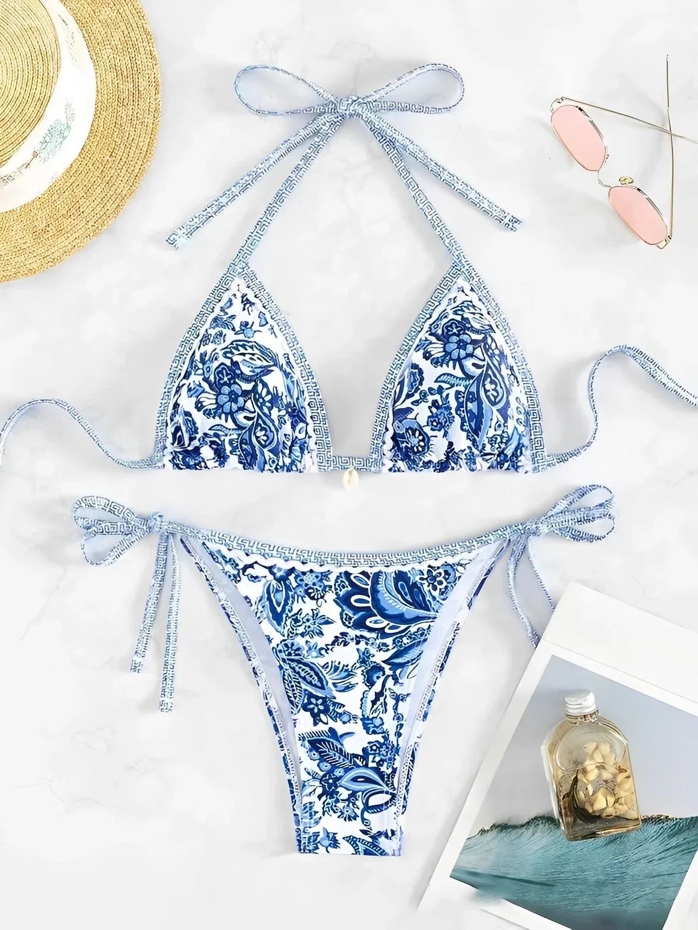 Blue and white floral bikini set flat lay