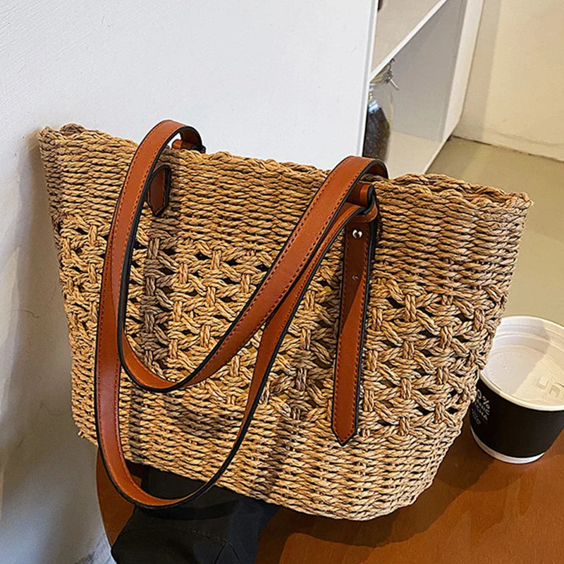 Woven cross-stitch tote bag beige on table with coffee cup