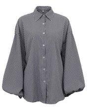 Black and white checkered shirt with buttons, front view
