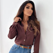 Burgundy classic blouse front view with belt and jeans