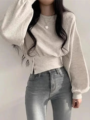 Hoodie beige met lange mouwen en knoopdetails front view
