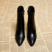 Black leather ankle boots front view with pointed toe