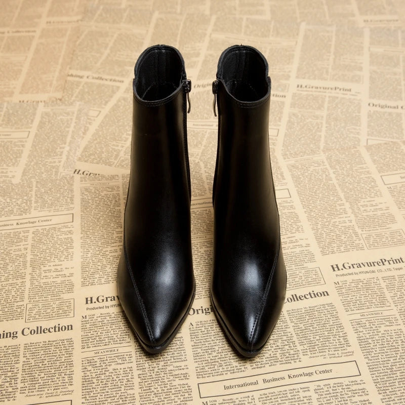 Black leather ankle boots front view with pointed toe