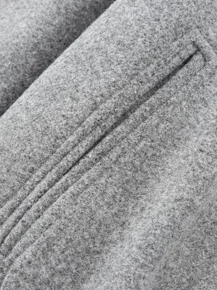 Grijze bomberjas met ritsdetail close-up