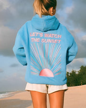 Blue hoodie with sunset design beach setting