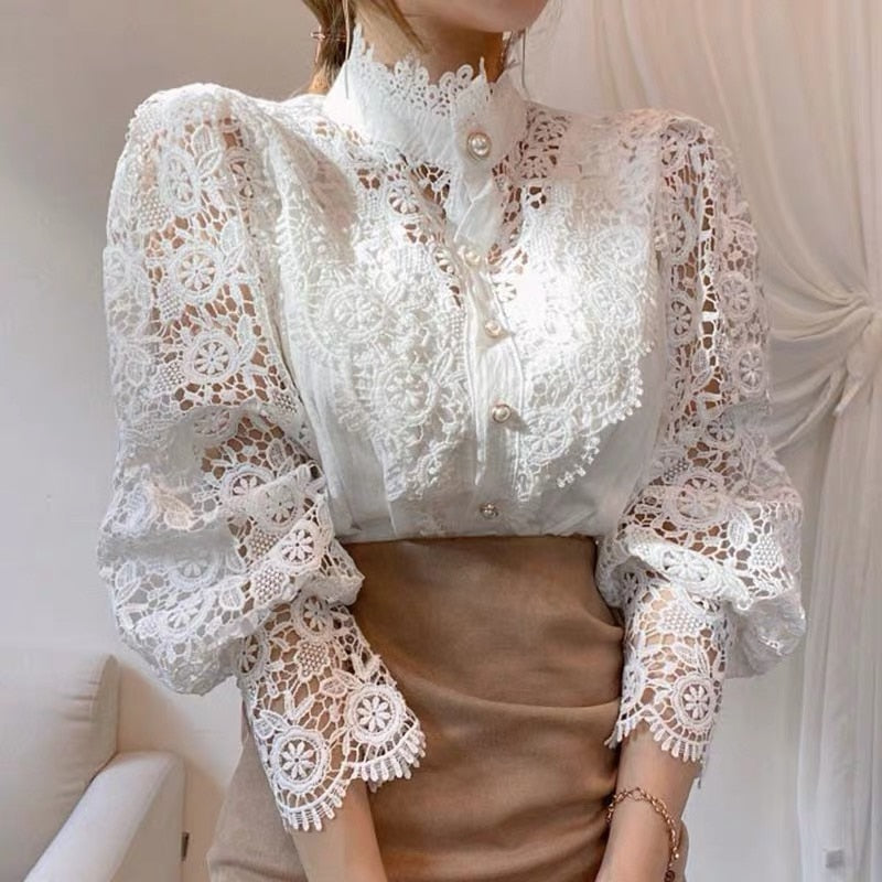 White lace blouse with puffed sleeves close-up on model