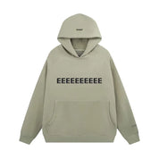 Oversized hoodie beige met zwarte letters front view