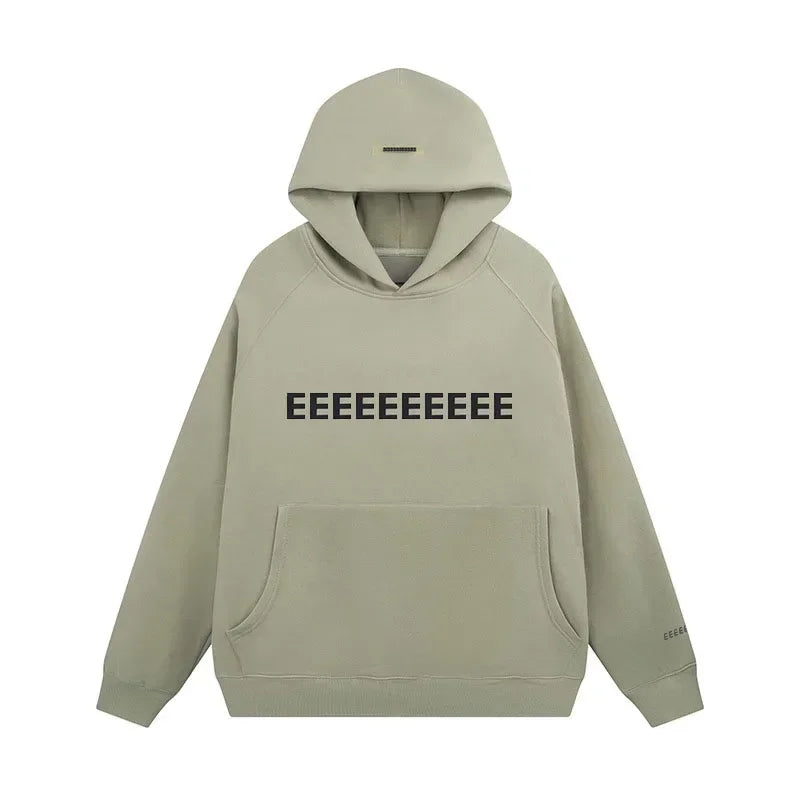 Oversized hoodie beige met zwarte letters front view