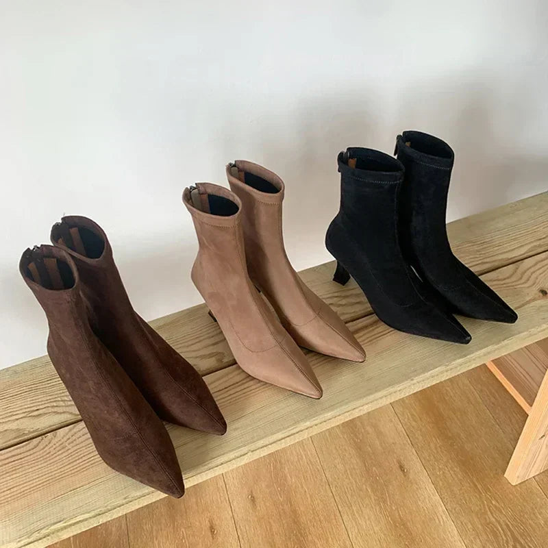 Brown, beige, and black suede ankle boots, side-by-side display