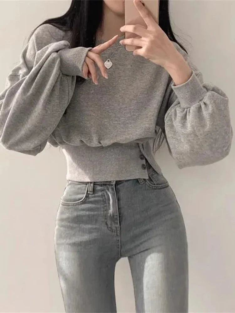 Grijze hoodie met lange mouwen en knoopdetails, front view