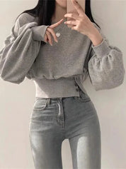 Grijze hoodie met lange mouwen en knoopdetails, front view