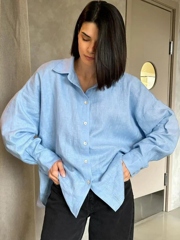 Light blue linen blouse with black pants, front view
