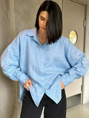 Light blue linen blouse with black pants, front view