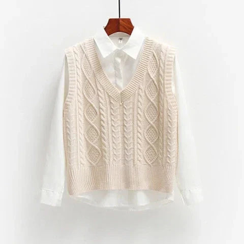 Beige knitted vest with cable pattern over white shirt front view