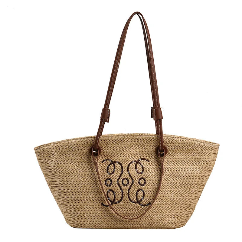 Woven straw tote bag with monogram embroidery front view