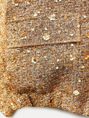 Jas met gouden en zilveren pailletten detail shot