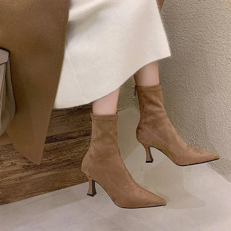 Beige suede ankle boots with pointed toe, front view