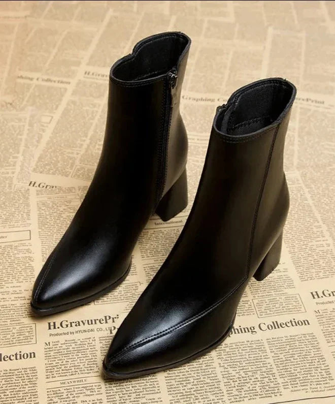 Black leather ankle boots side view with zipper detail