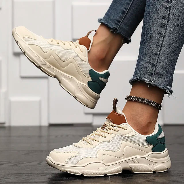 Chunky sneakers white with brown and green accents side view