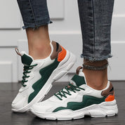 Chunky sneakers white with green and orange accents side view