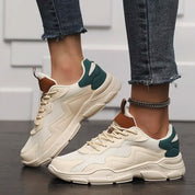 Chunky sneakers white with green and brown accents front view