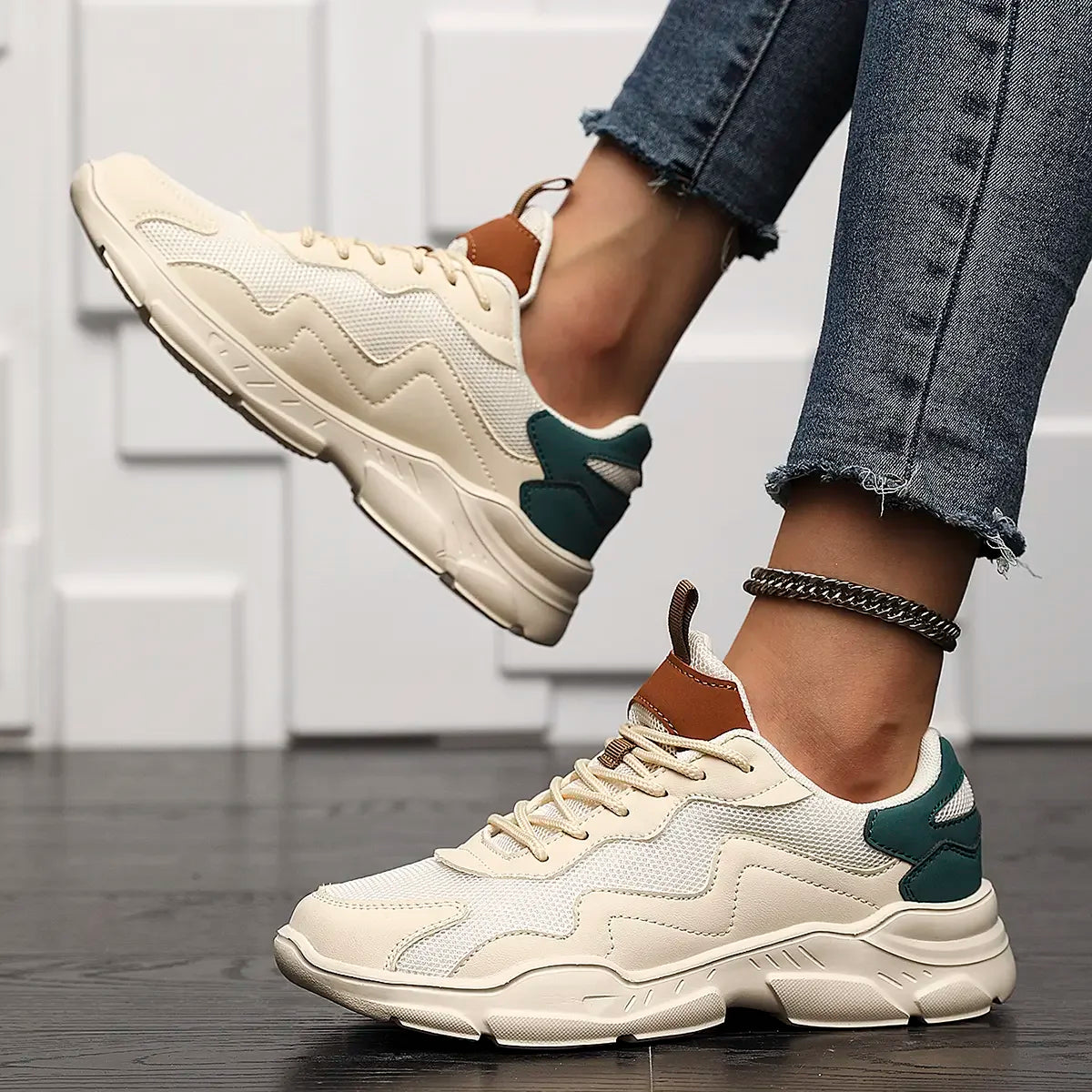 Chunky sneakers white with brown and green accents angled view