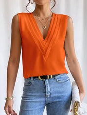 Orange blouse with V-neck and pleats, front view