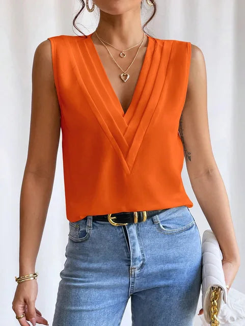 Orange blouse with V-neck and pleats, front view