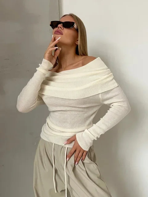 White off-shoulder ribbed sweater with sunglasses