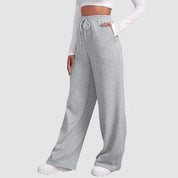 Damesbroek grijze joggingbroek met elastische taille en zakken, achterzijde