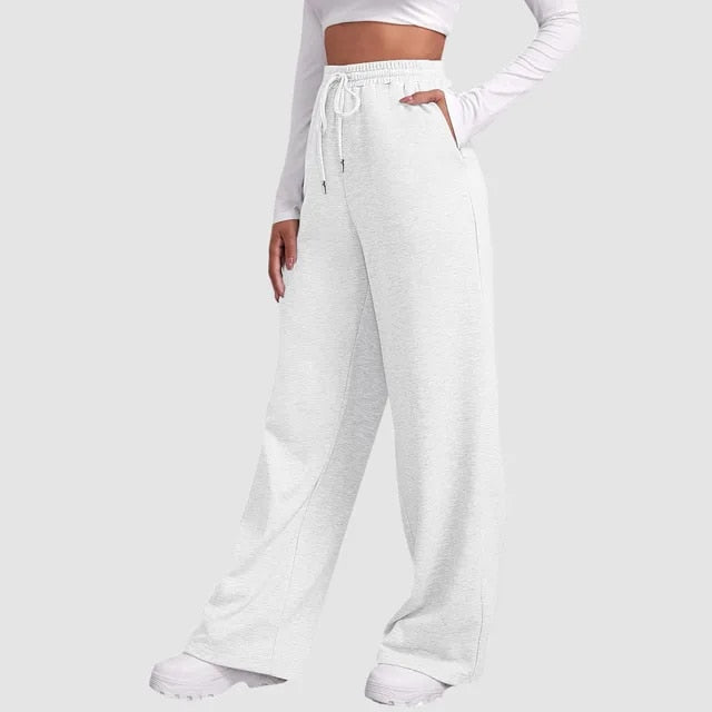 Damesbroek witte joggingbroek met zakken en riemzakken zijprofiel