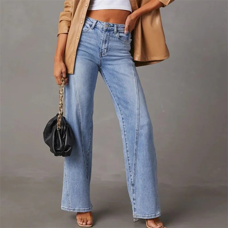 Light blue denim jeans front view with model wearing beige blazer