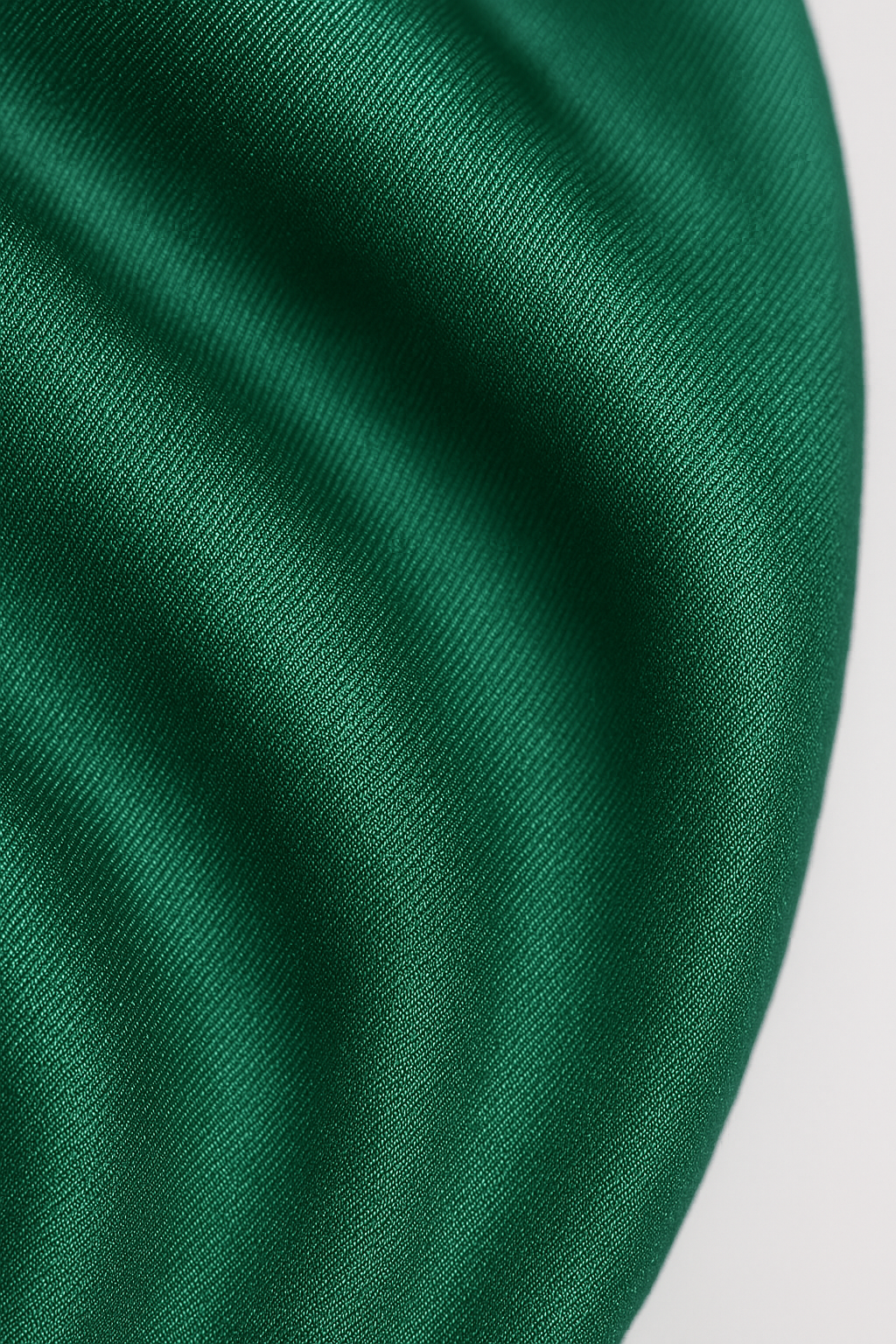 Green drapé romper fabric texture close-up