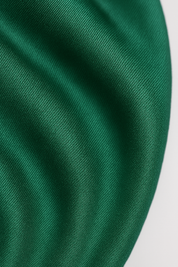 Green drapé romper fabric texture close-up