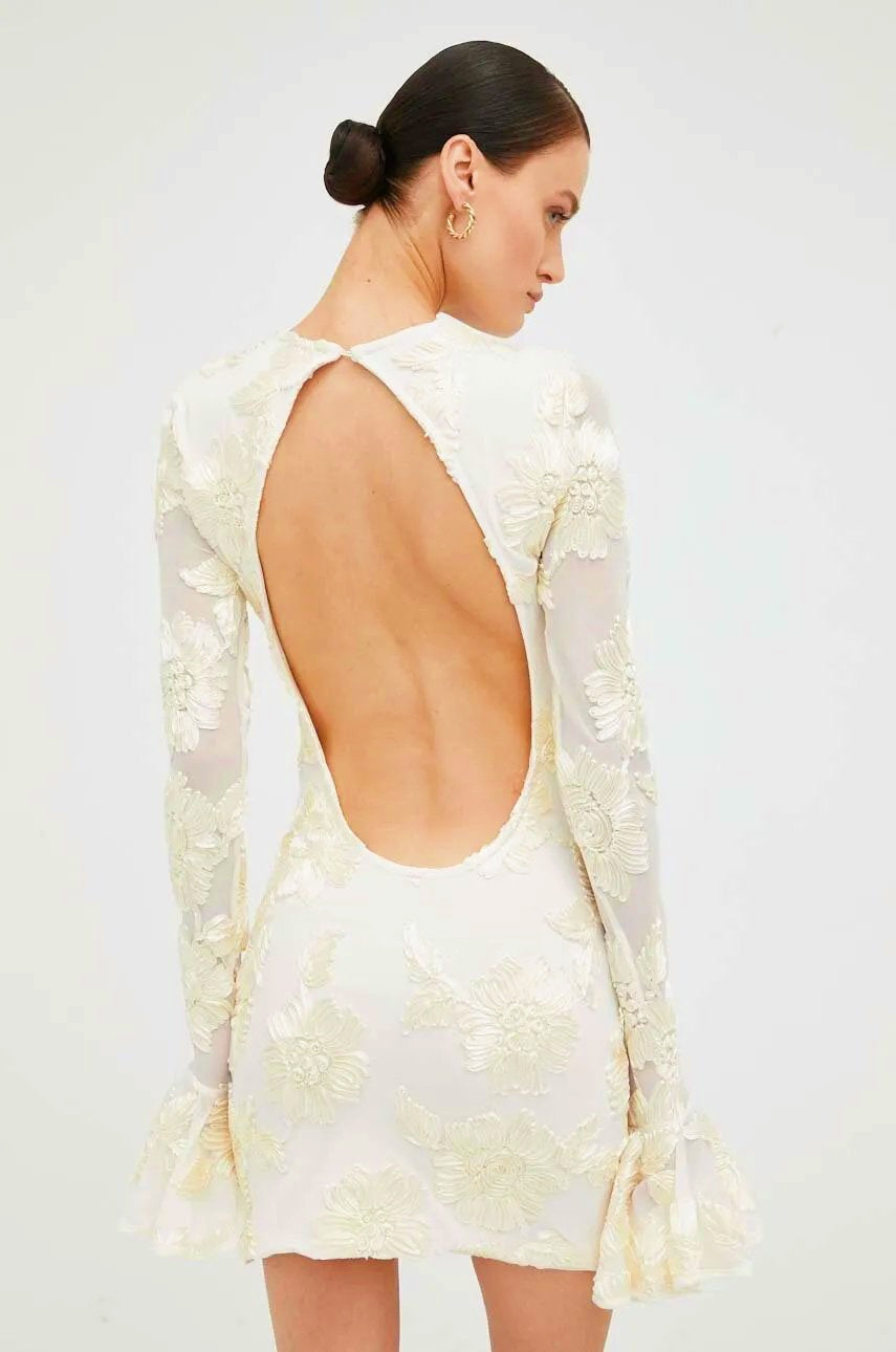 White embroidered mini dress with open back detail
