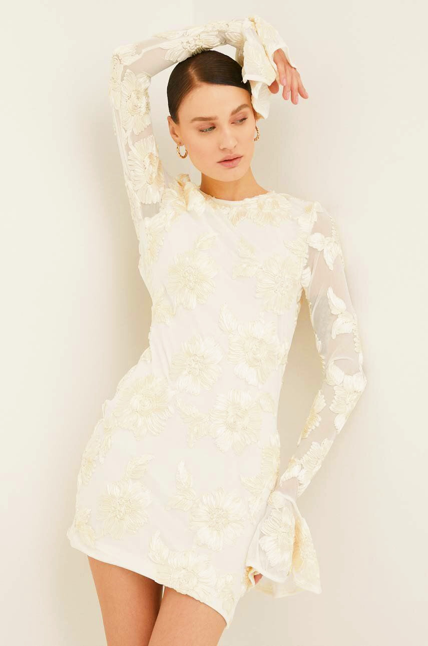 White embroidered mini dress with bell sleeves front view