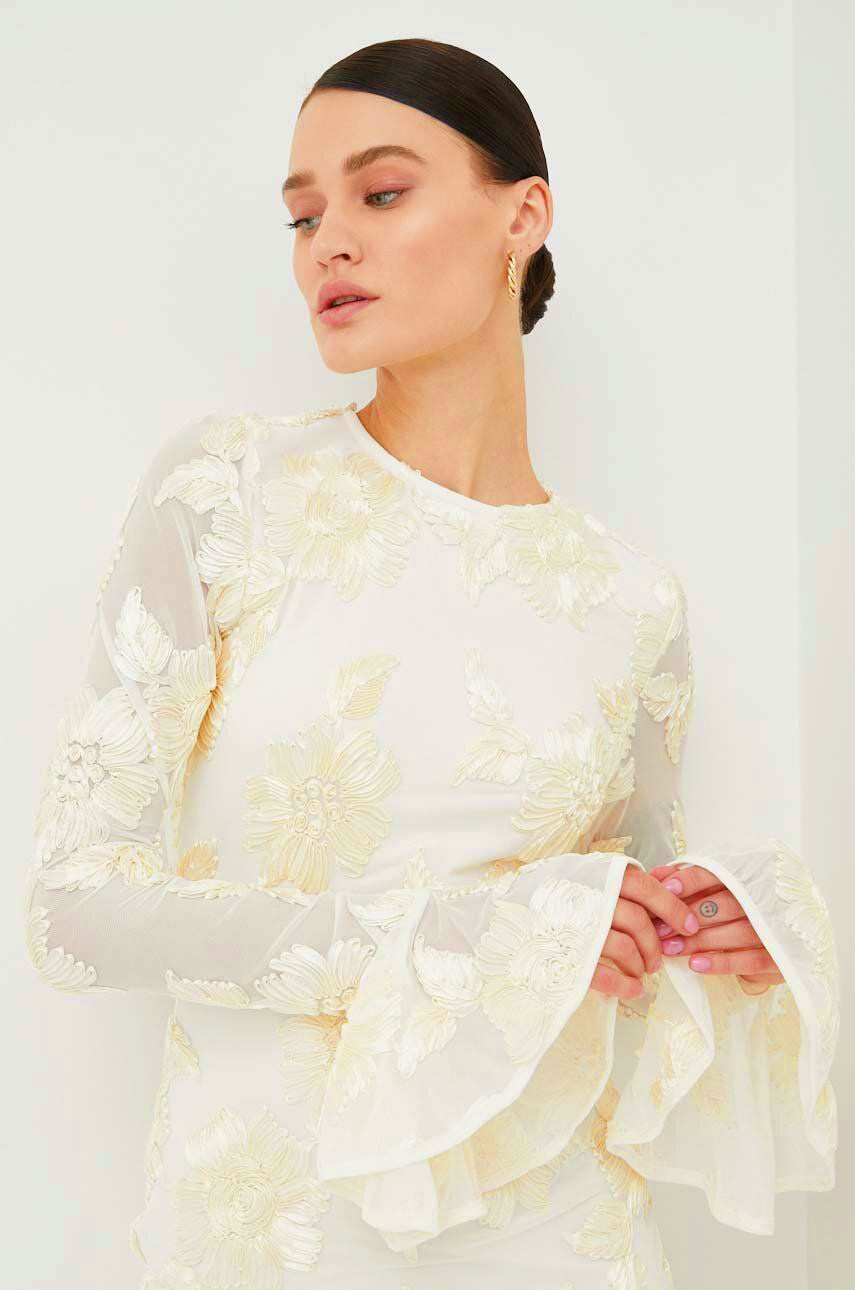 White embroidered mini dress with bell sleeves side profile