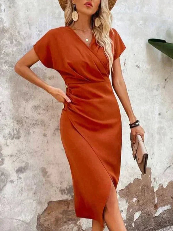 Midi dress orange with V-neck and side slit front view with hat