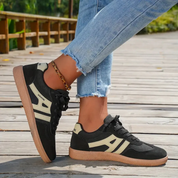 Black and beige retro sneakers close-up detail