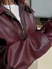 Oversized faux leather jacket maroon detail of texture