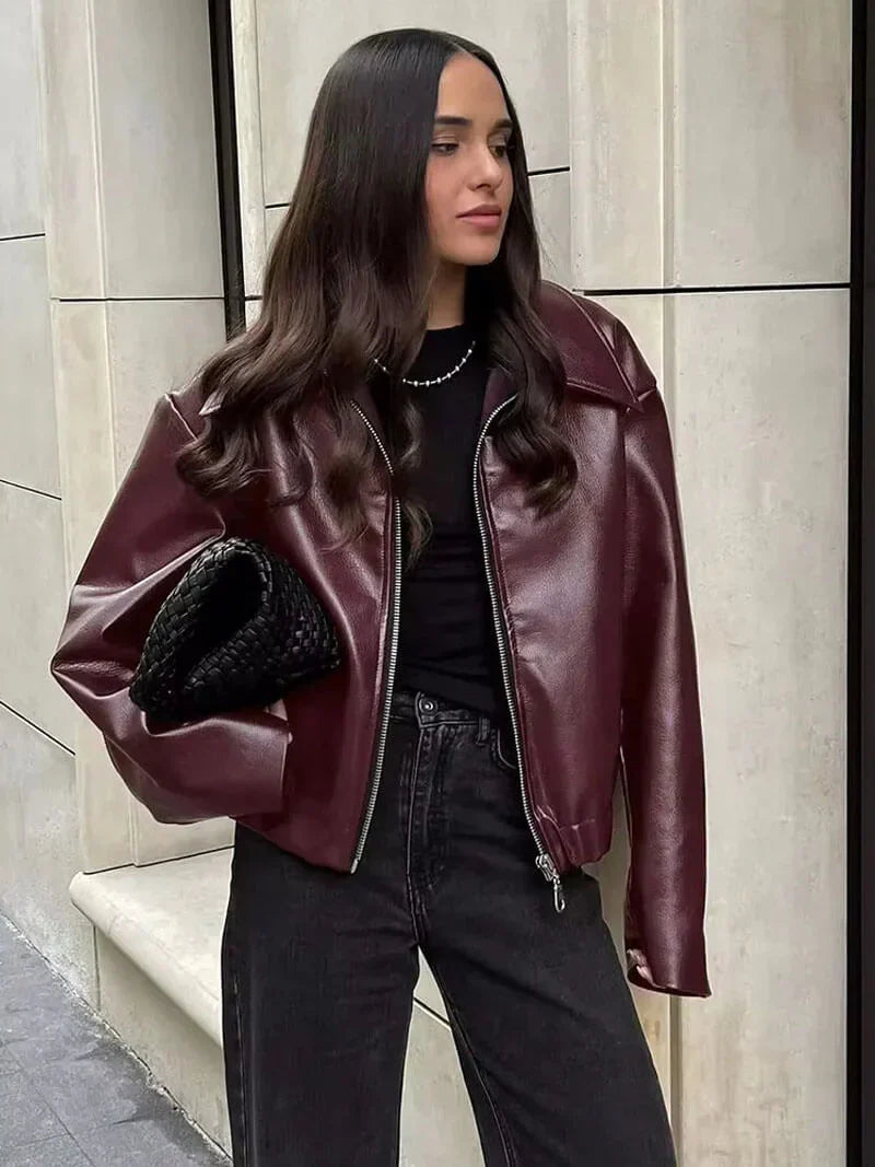 Oversized faux leather jacket maroon worn with black top