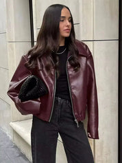 Oversized faux leather jacket maroon worn with black top
