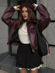 Oversized faux leather jacket maroon worn with beret