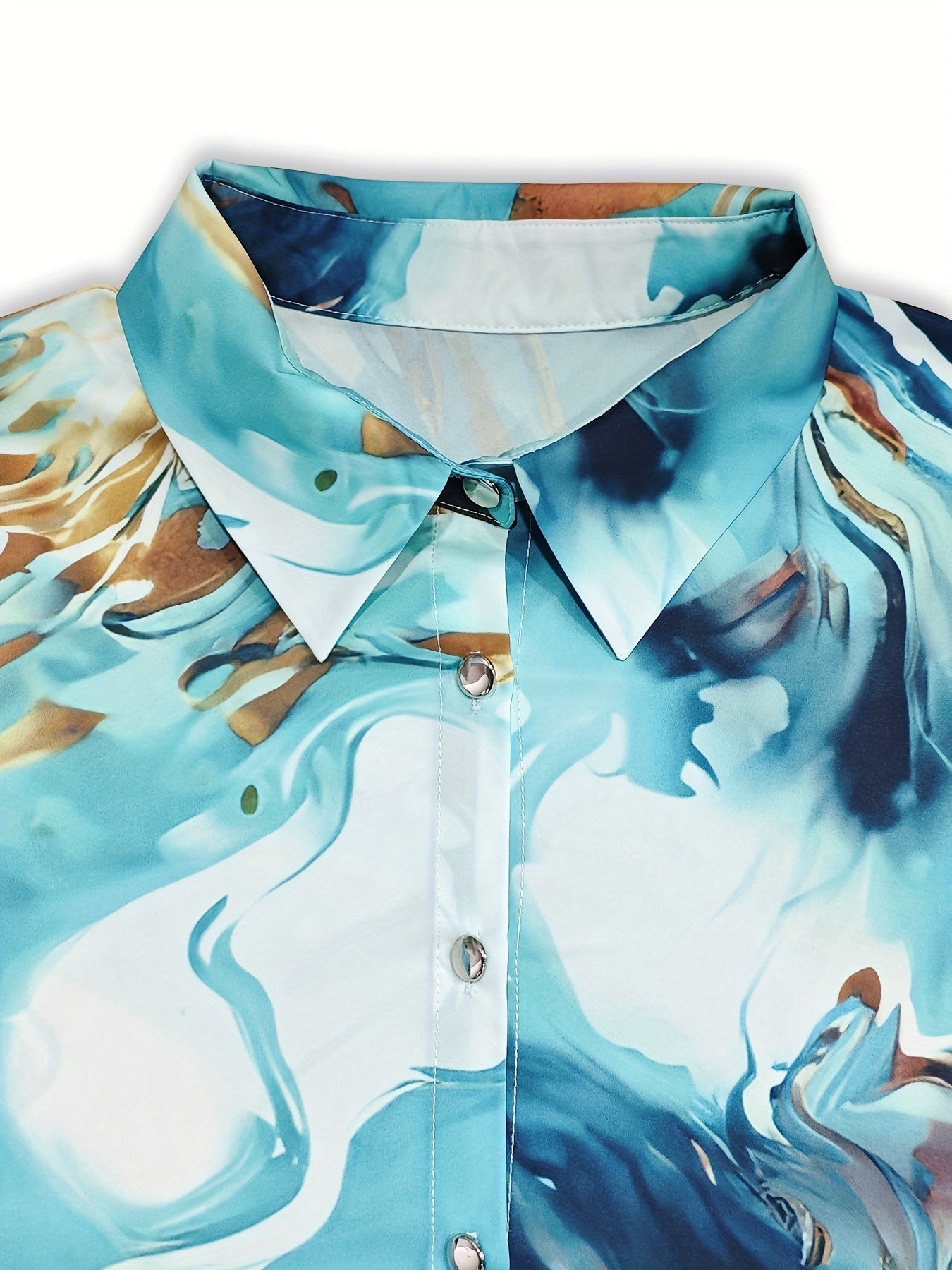 Silk blouse with abstract marbled print, close-up of collar