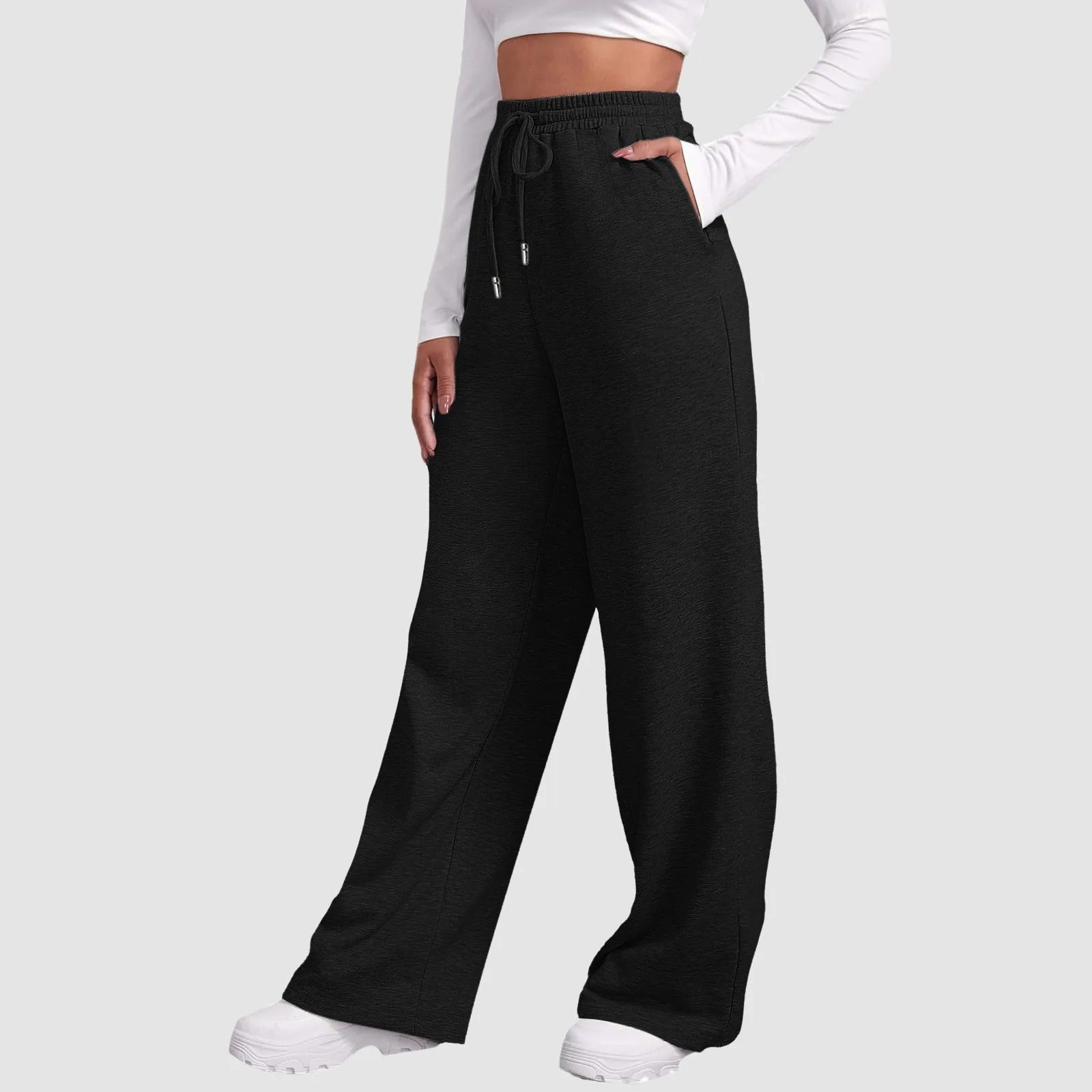 Dames trainingsbroek zwart met elastische taillezakken zijprofiel
