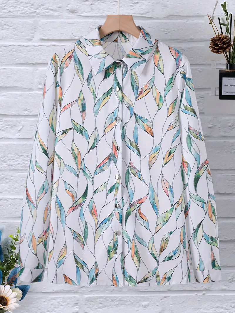 Blouse with leaf print and white background, front view on mannequin with flowers