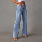 Light blue denim jeans side view with model wearing white top