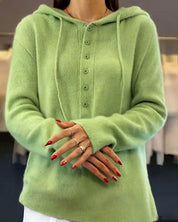 Groene gebreide hoodie met knopen vooruitschot